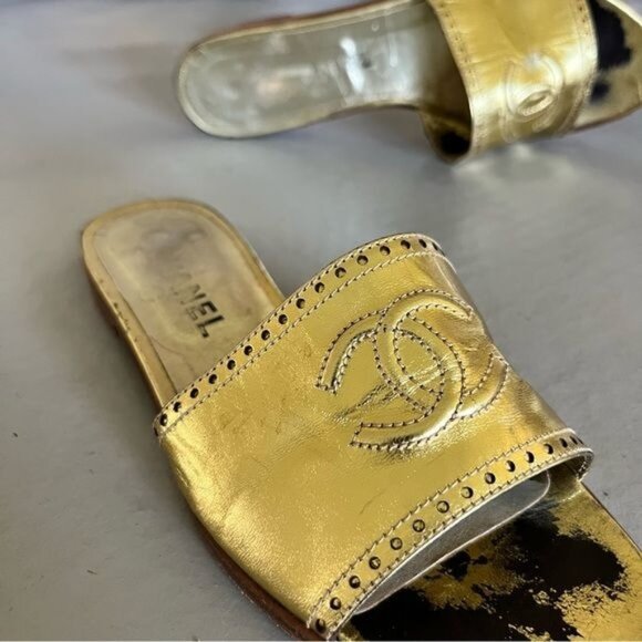 CHANEL Shoes - Chanel Gold Embossed Leather Interlocking C Slide Sandals